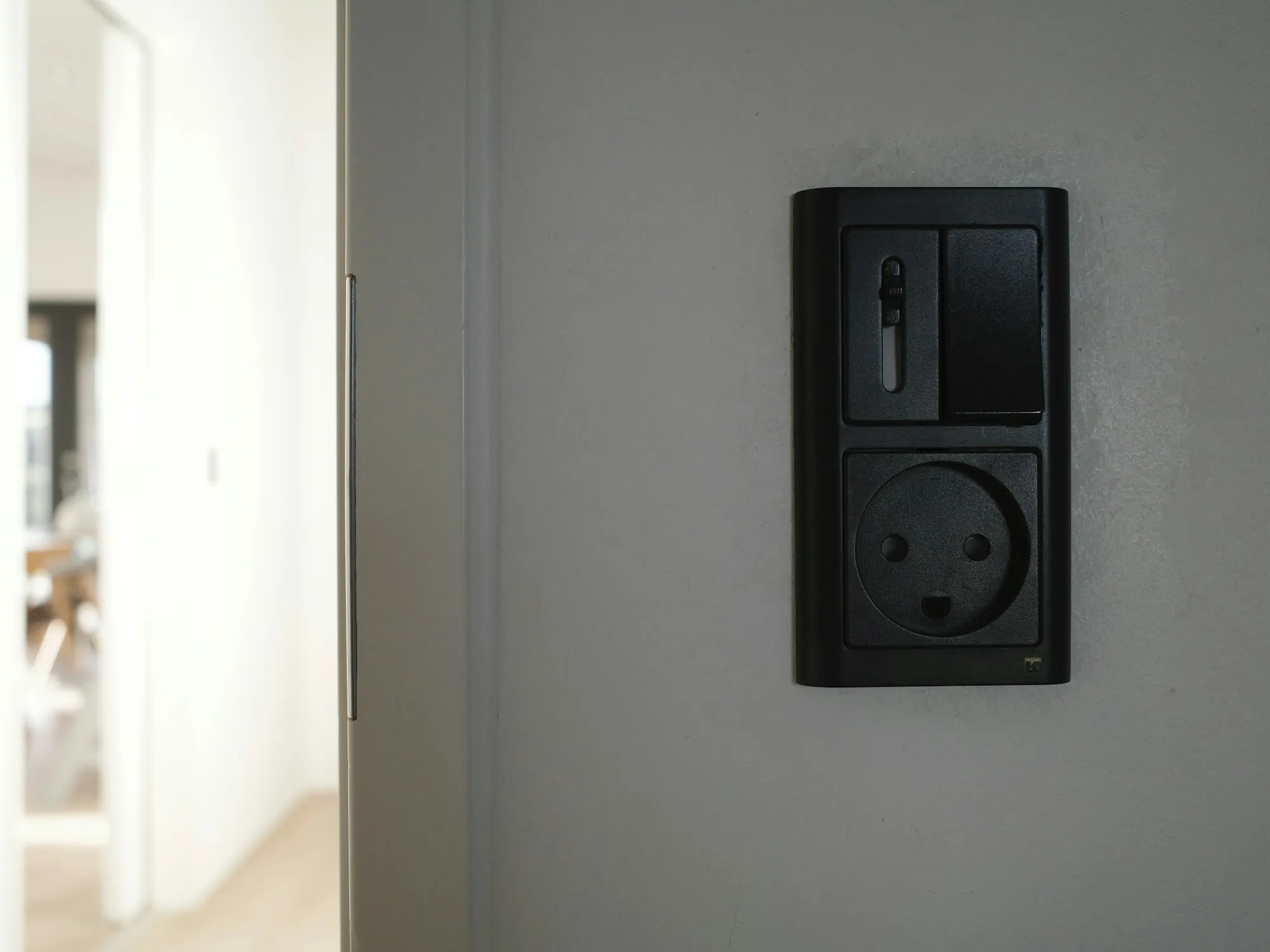 Electrical outlet and switch on a wall
