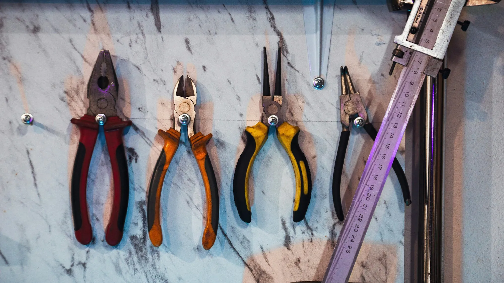 Electrician's pliers laid out on a work surface
